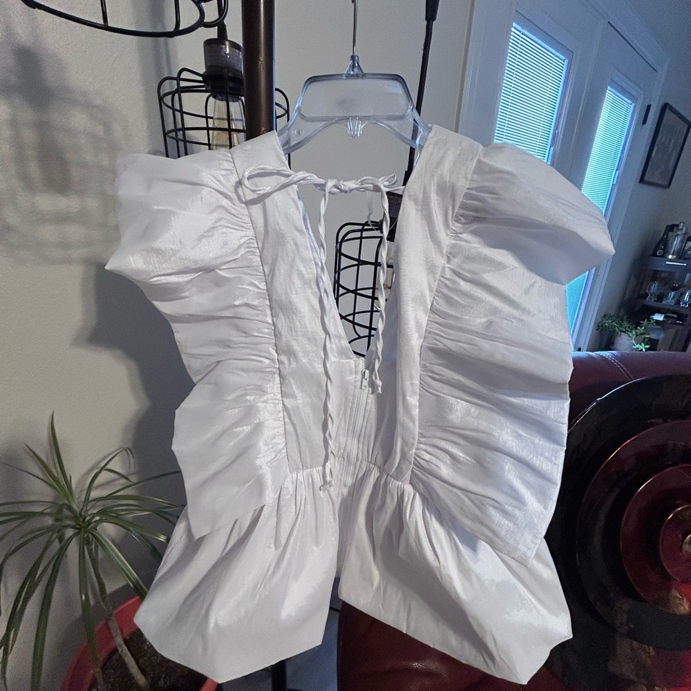 Beautiful white dressy top to wear this summer with a skirt , pants or jeans.